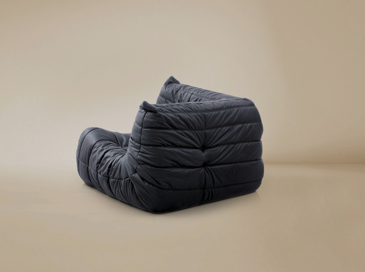 Back view of the TOGO corner unit showing the fully upholstered finish for open floor plan placement.