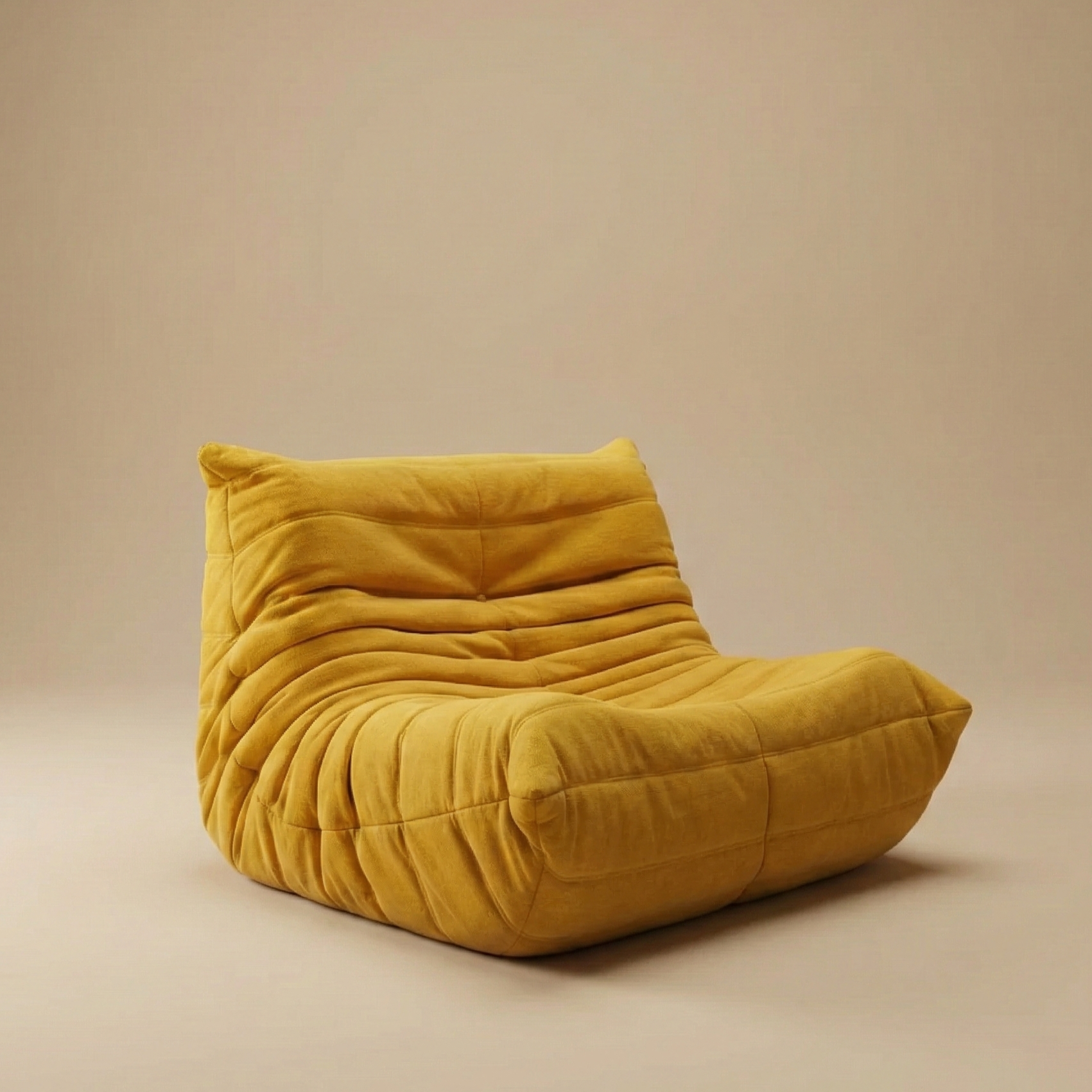 TOGO Lounger single seat accent chair in bold mustard yellow velvet with gathered seam details.