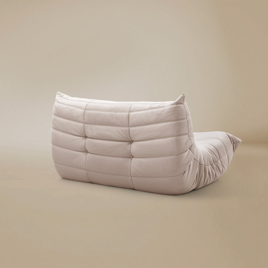 Back view of the TOGO Lounger showing the fully upholstered finish and low profile silhouette.