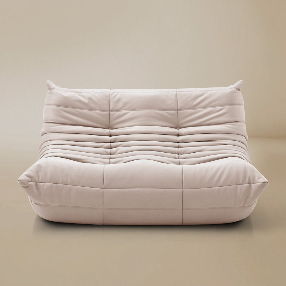 White cushioned chair on a beige background
