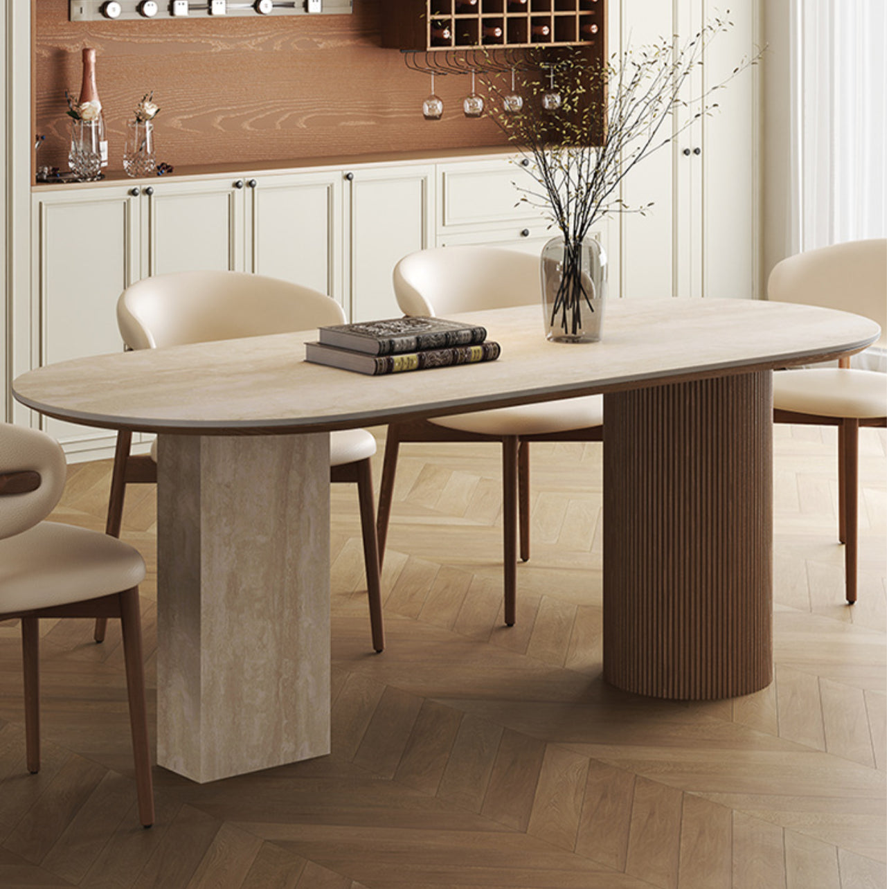 Side view of travertine sintered stone dining table with wood base and cream chairs in elegant kitchen interior