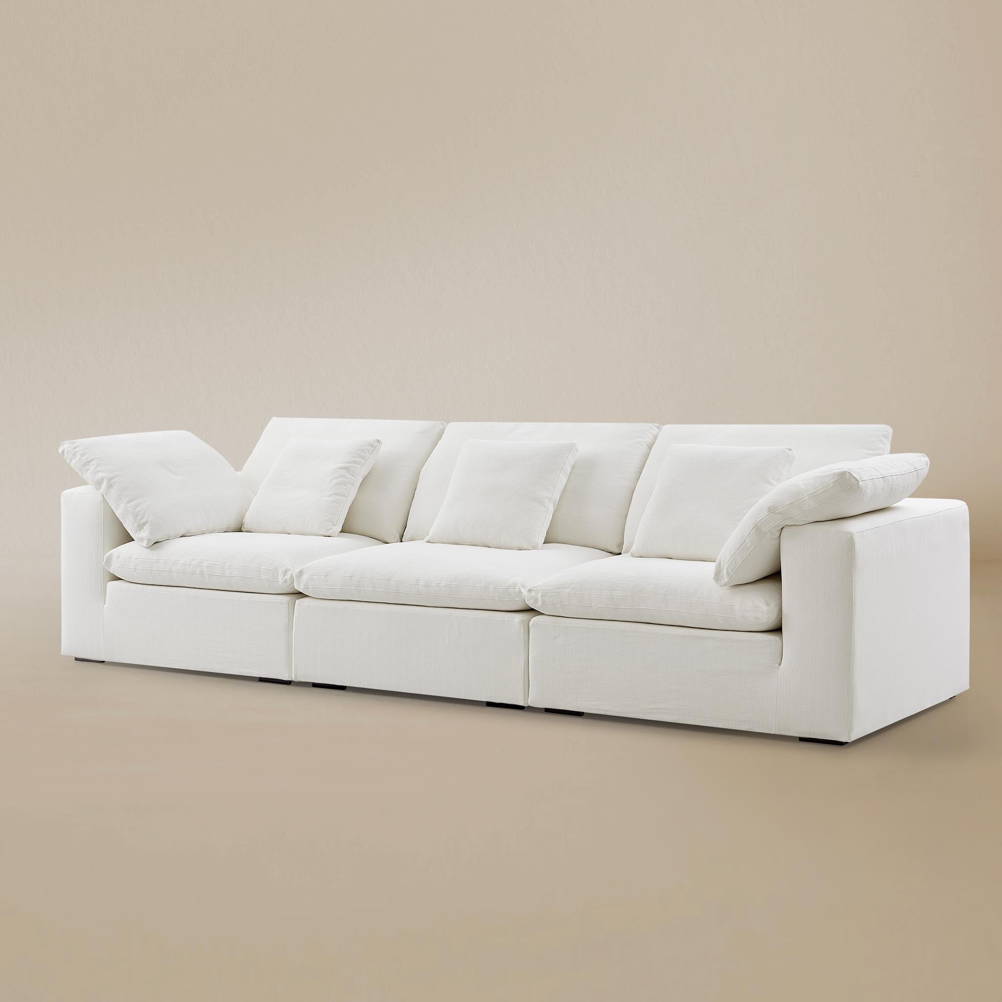 Ultra softness modular sofa three seater on a beige studio background