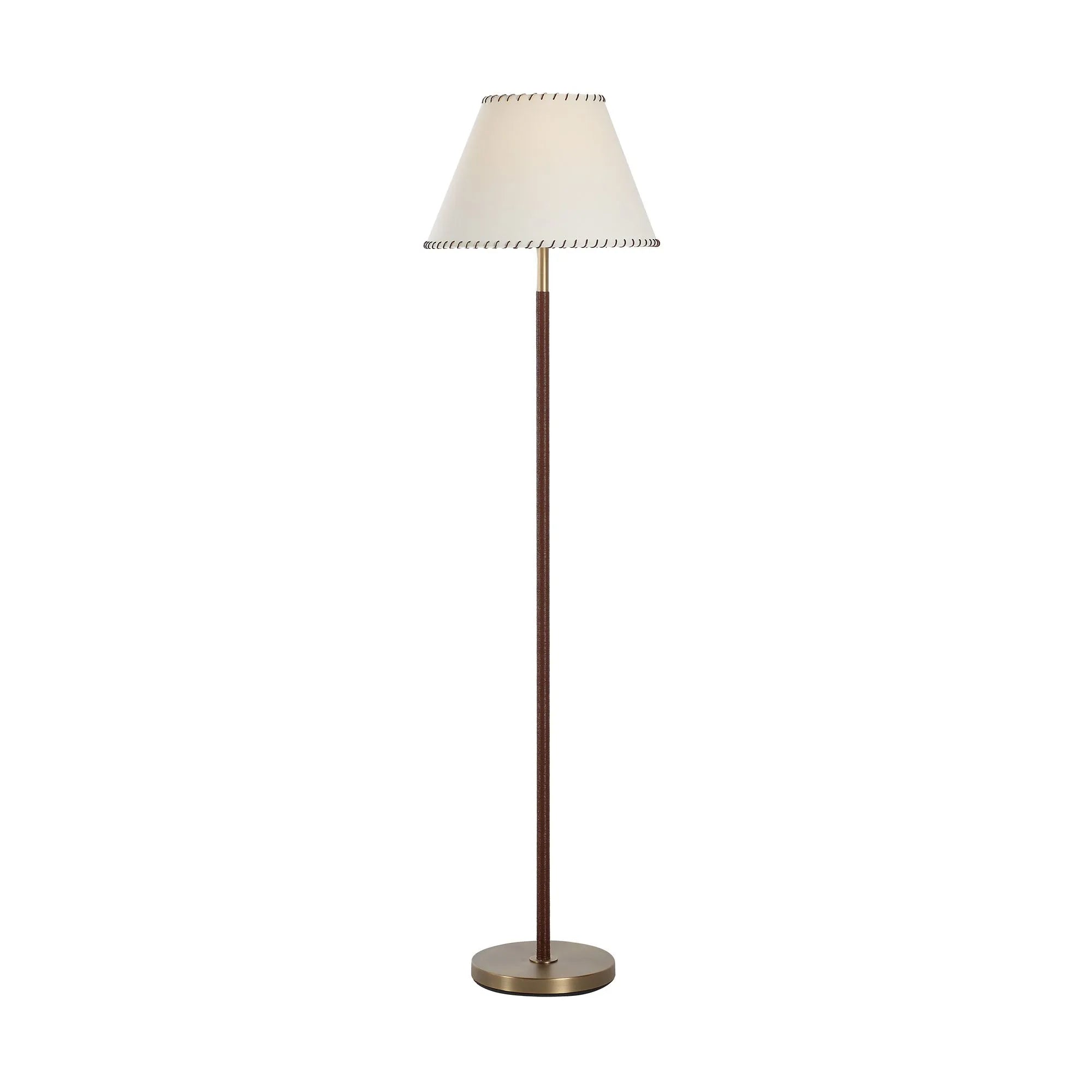 Valen leather wrapped floor lamp illuminated, showing a warm light glow through the fabric shade.