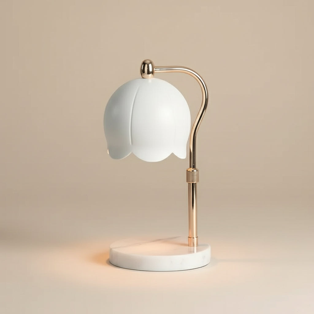 White Lily Adjustable Height Candle Warmer with white dome shade and gold stand on a marble base.