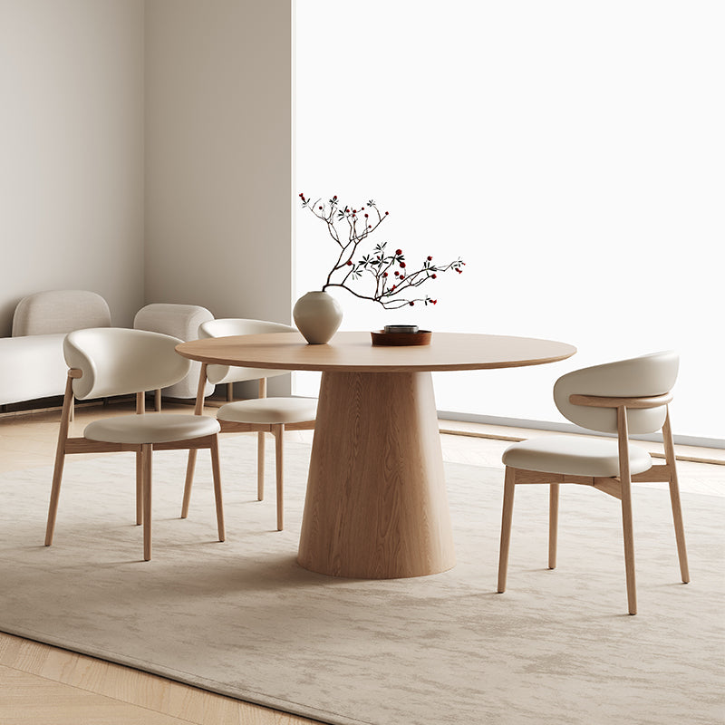 Willow Ridge round dining table in solid wood with ash veneer styled with cream chairs and vase
