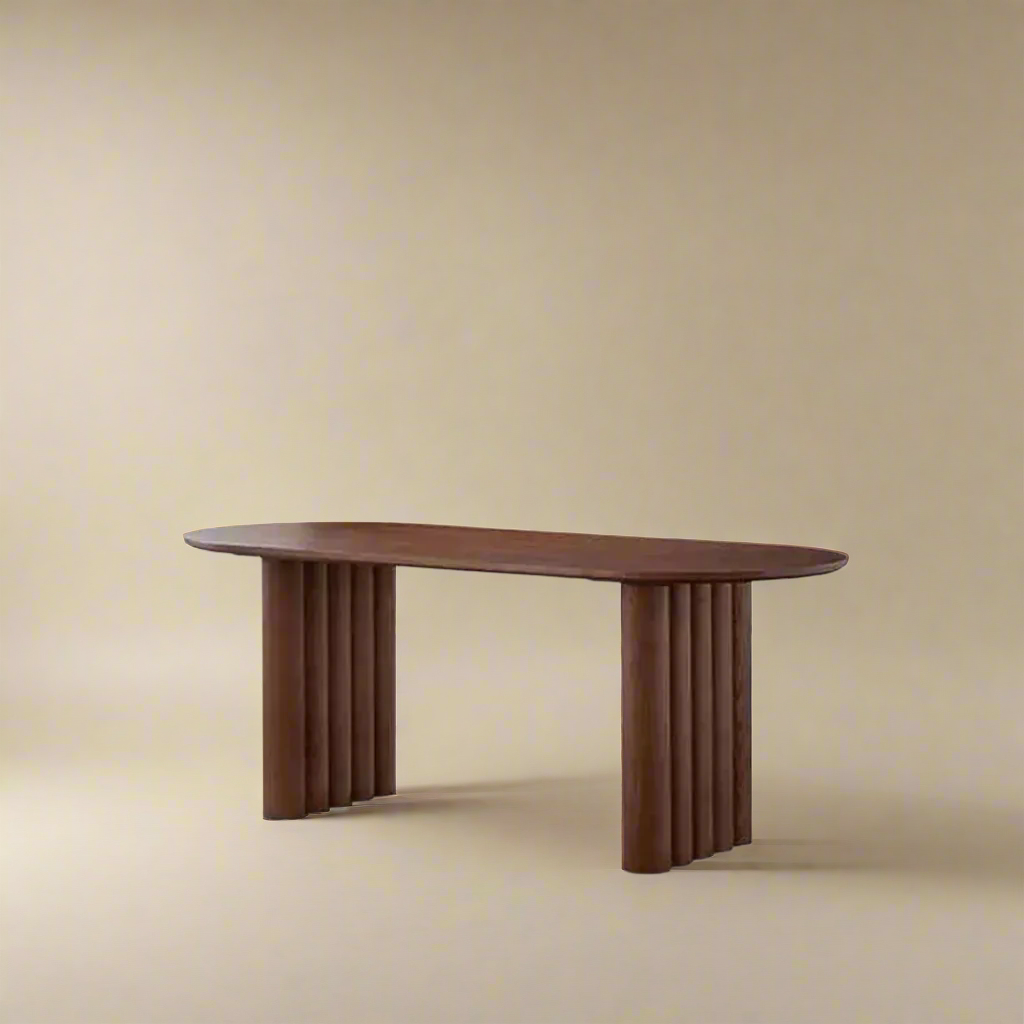 Adrian solid wood dining table with fluted legs and oval top on beige studio background