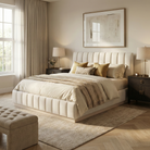 Side view of the Alora Ashwood bed highlighting the continuous light wood base rail and plush cream fabric upholstery.