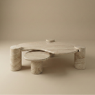 Ardea travertine coffee table set featuring a two-tier organic kidney bean shape and sturdy cylindrical stone legs.