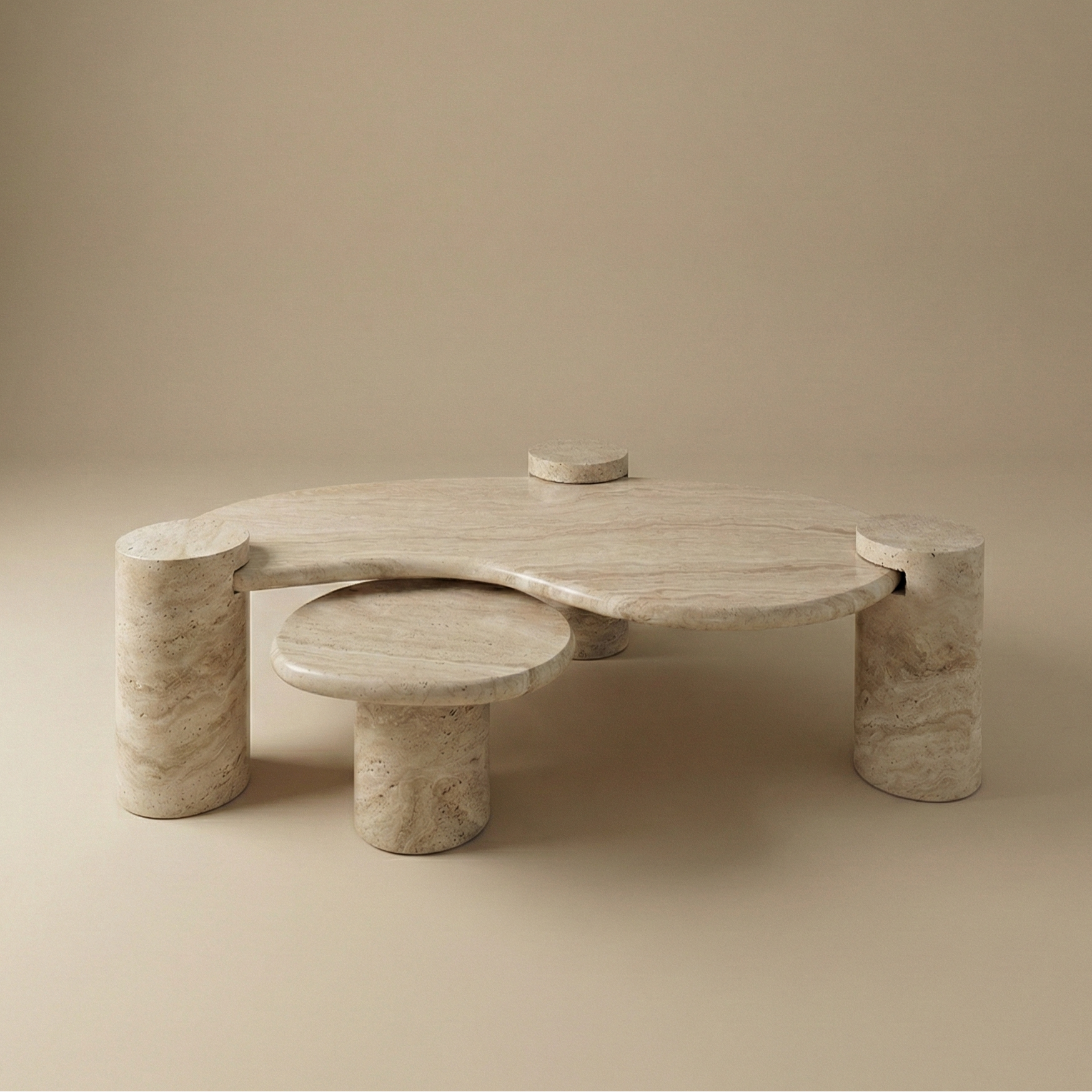 Ardea travertine coffee table set featuring a two-tier organic kidney bean shape and sturdy cylindrical stone legs.