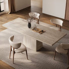 Top angle view of Ardella sintered stone dining table with trapezoid base and beige chairs in warm contemporary dining room