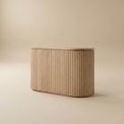 Arden Oak Night Stand with fluted oak body shown from the back view