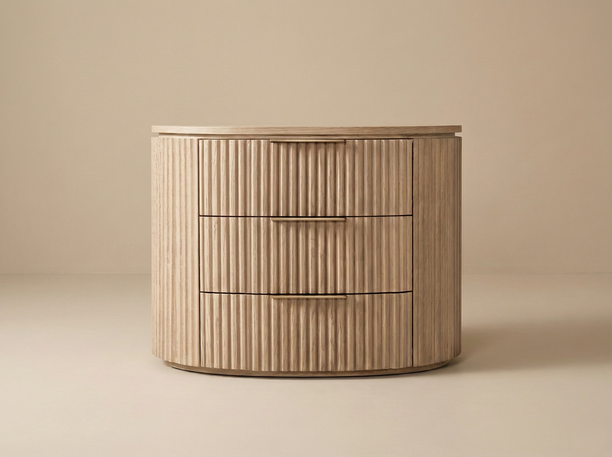 Arden Oak Night Stand with curved silhouette and fluted drawers, photographed in a warm beige studio