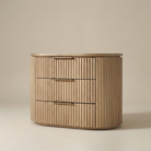 Arden Oak Night Stand with fluted solid oak drawers shown on a warm beige studio background