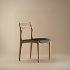 Aspen Classic Dining Chair with curved wood frame and black seat shown in a warm studio setting