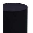 Close up view of the Atlas side table showing the smooth matte black finish and crisp cylindrical edge.