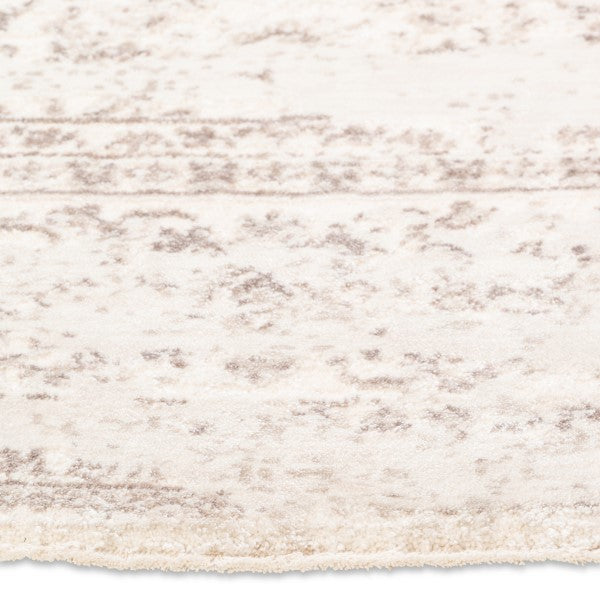 Close-up of the faded traditional pattern and soft cream pile on the Audrey distressed rug.