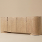 Aurelian Oak Sideboard featuring a modern pill-shaped silhouette with curved ends and thick cylinder legs.