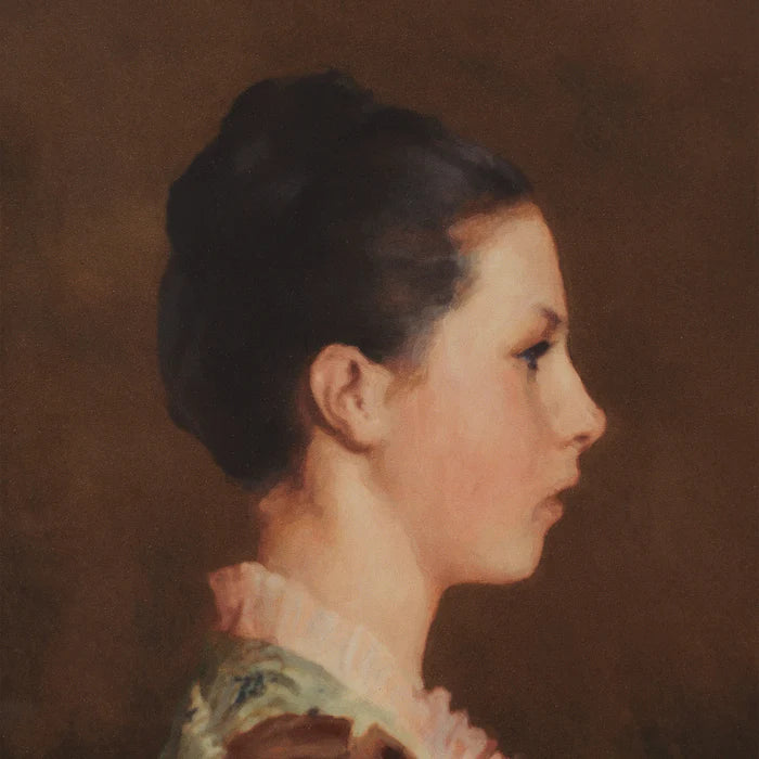 Close-up of the Beatrice wall art showing a painted side profile portrait of a woman against a dark brown background.