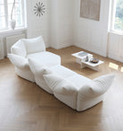 Top view of Blooming Embrace Modular Sofa in white fabric arranged in a curved layout within a bright modern living room