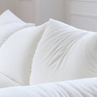 Close-up of Blooming Embrace Modular Sofa cushions showcasing soft white textured fabric and plush comfort design