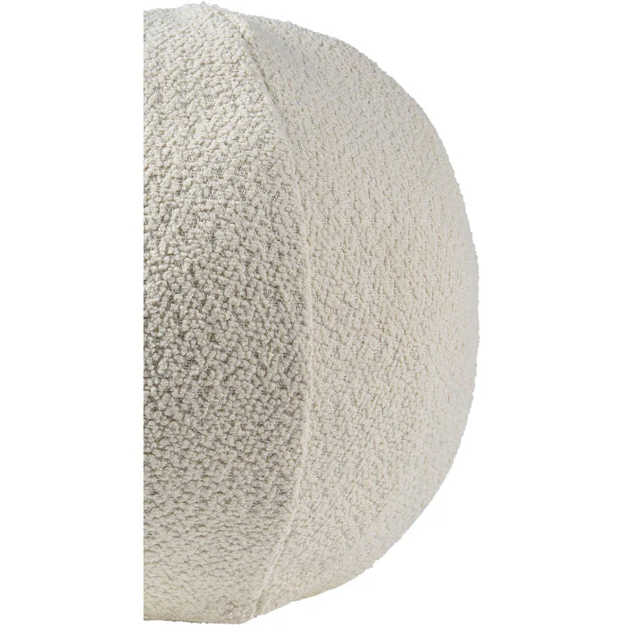 Side view of the ivory bouclé sphere pillow highlighting the intersecting seam detail that gives it a perfect round shape.