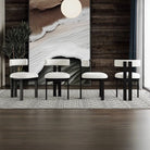 Set of Bouclé Ash Wood Dining Chairs with white bouclé seats and black ash frames styled in a modern dining space with textured rug.