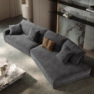 Budapest Lounger in dark grey ultra suede fabric styled in a modern living room with marble accents and neutral decor