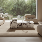 Bulgari Charm Tall Side Table styled next to a marble coffee table in a modern living room with floor-to-ceiling windows