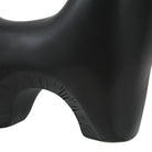 Close-up of Caldera Vase in matte black showing detailed arch texture and smooth sculptural curve