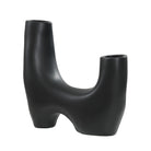 Caldera Vase in matte black finish with sculptural double opening and arched base design