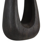 Close-up of Calla Table Lamp showcasing the textured black wood base with smooth sculptural finish