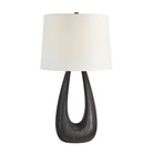 Calla Table Lamp featuring a sculpted black wood base with an open center and white drum fabric shade