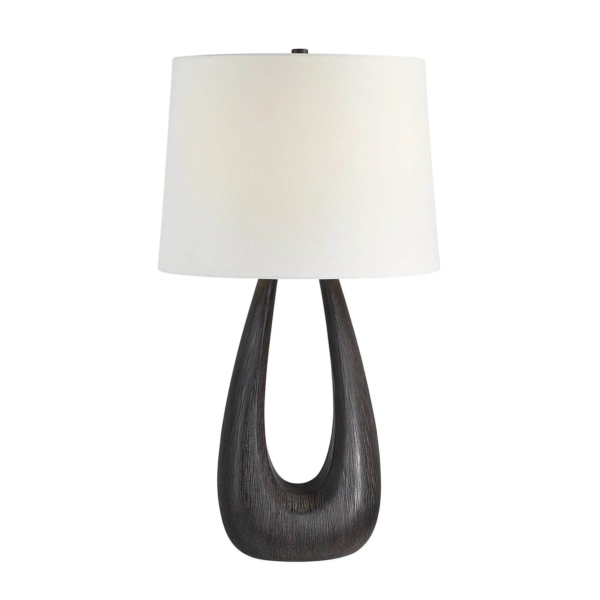 Calla Table Lamp featuring a sculpted black wood base with an open center and white drum fabric shade