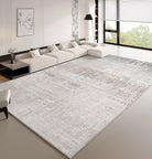 Calm Grey Haven Rug styled in a modern living room with neutral sectional sofa and large windows