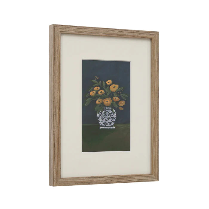 Angled view of the Clementine floral wall art highlighting its natural light wood frame and crisp white matting.