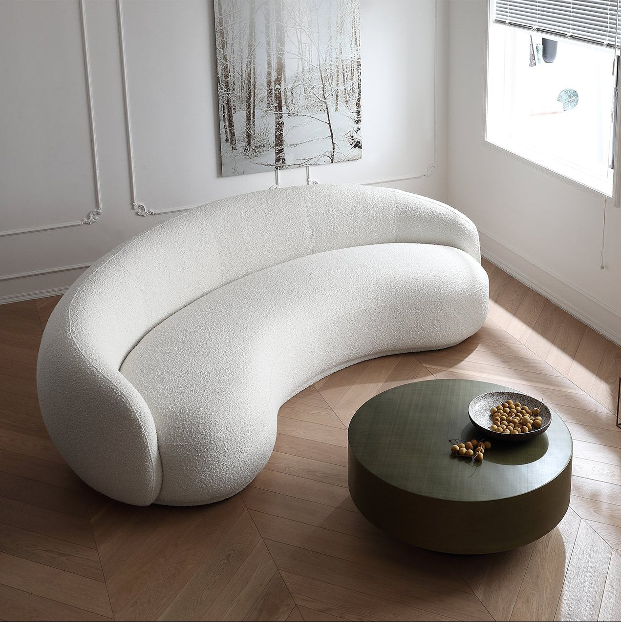 Contour Bliss Bouclé Sofa in white curved design viewed from above beside round coffee table