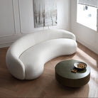 Contour Bliss Bouclé Sofa in white curved design viewed from above beside round coffee table