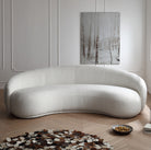 Contour Bliss Bouclé Sofa in white bouclé fabric with curved design in modern living room interior