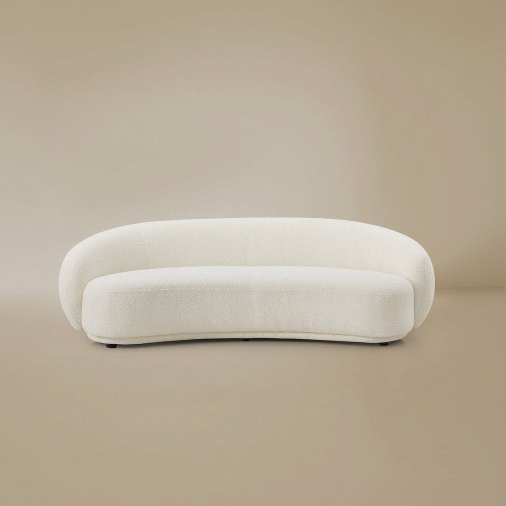 White, modern Contour Bliss Boucle sofa on a beige background