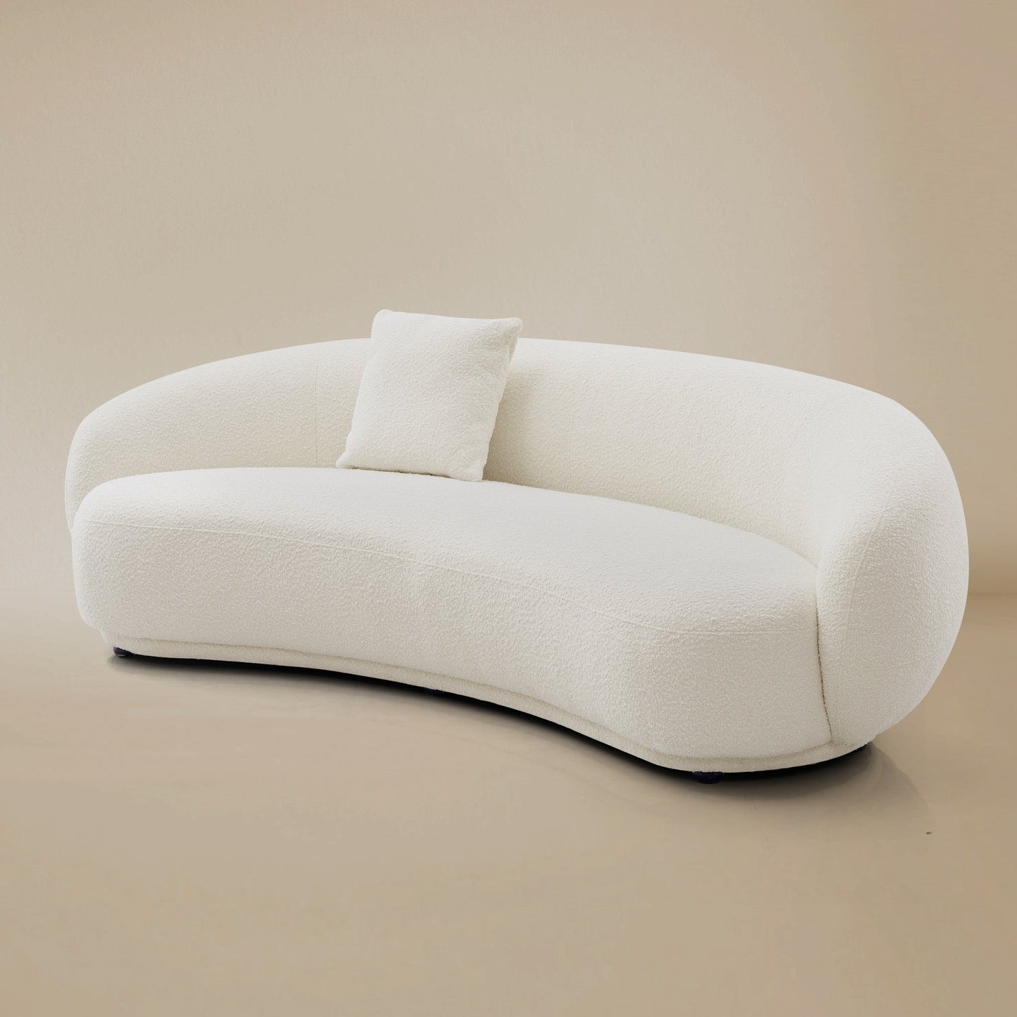 Warm Contour Bliss Boucle Sofa in beige studio background