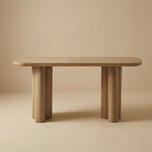 Front view of the Daro console table in natural wood, featuring a thick pill-shaped top and chunky triple-cylinder legs.