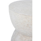 Close up detail of the Dune side table showing the horizontal ribbed texture and organic stone-like surface.