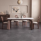 Eclipse Elegance dining table with sintered stone top and walnut curved legs styled with boucle dining chairs in a neutral modern dining room