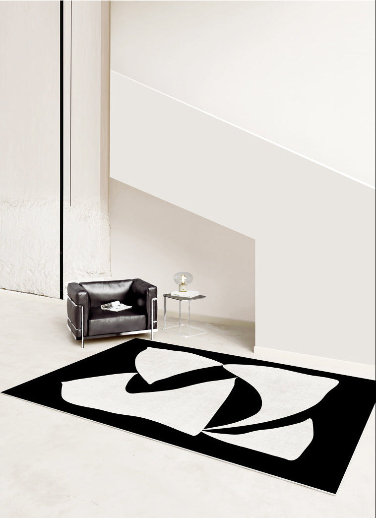 Elegance in Motion Rug in a minimalist space with black and cream abstract design