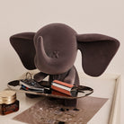 Elephant Sculpture Key Holder Tray in matte grey holding keys and lipstick on metal tray atop dresser
