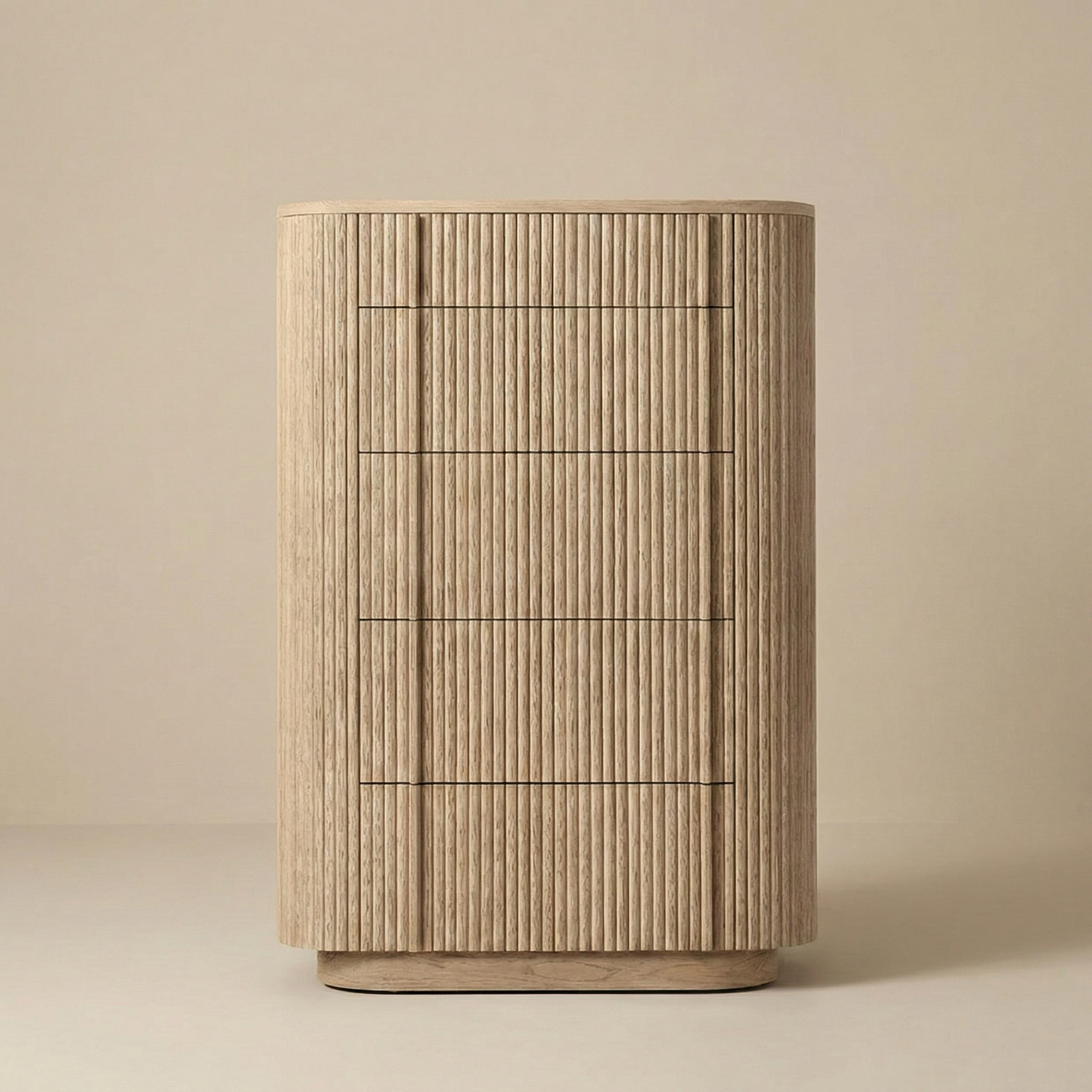 Front view of the Elias tall chest of drawers in natural oak, featuring a curved silhouette and five deep drawers with ribbed wood detail.
