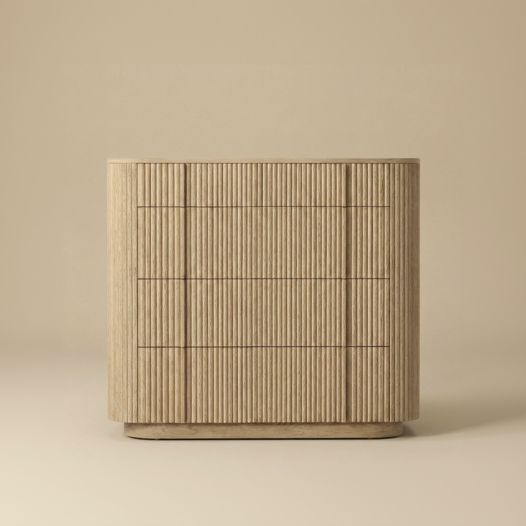 Elias wide oak dresser featuring continuous vertical fluting, rounded corners, and spacious storage drawers for a modern organic bedroom.