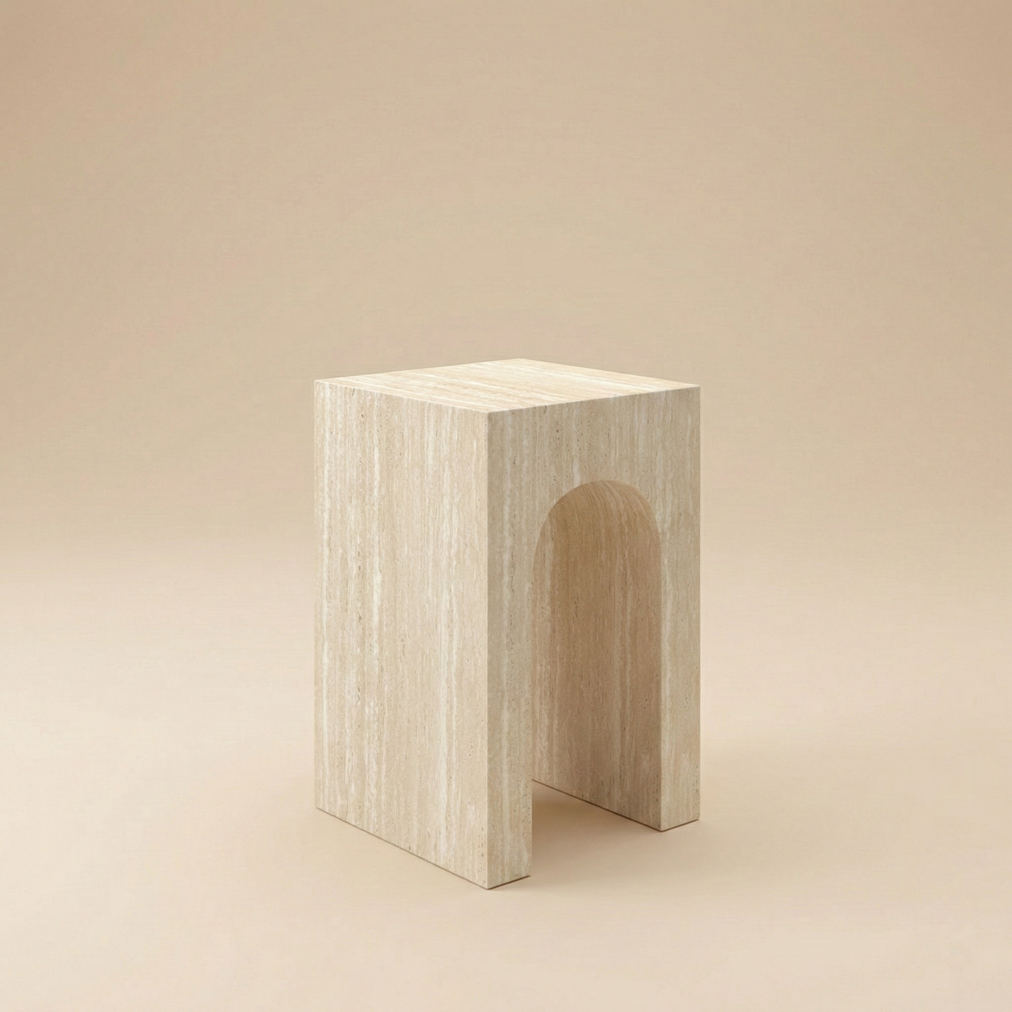 Arched Elio side table with a smooth, beige travertine stone texture, centered against a seamless monochromatic beige studio background.