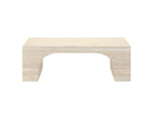 Front view of the Elio travertine coffee table with sculptural arched base