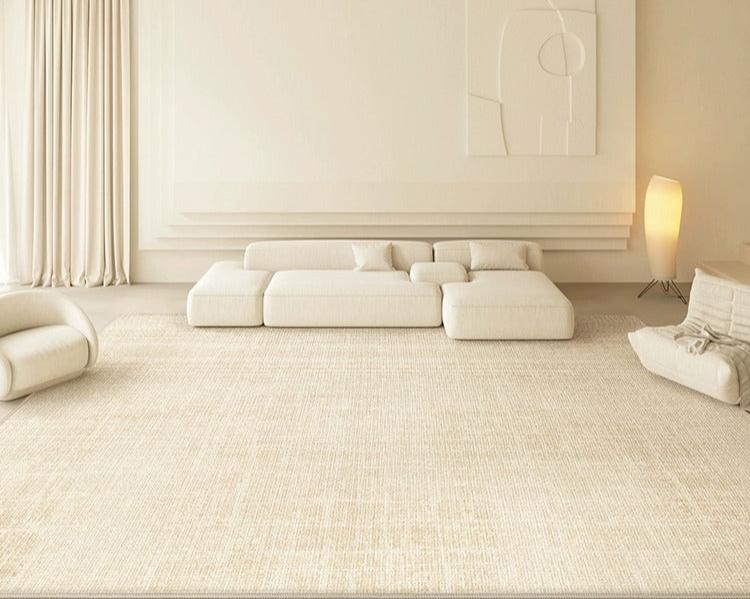 Elise Rug styled in a minimalist beige living room with low modular sofas and soft neutral decor